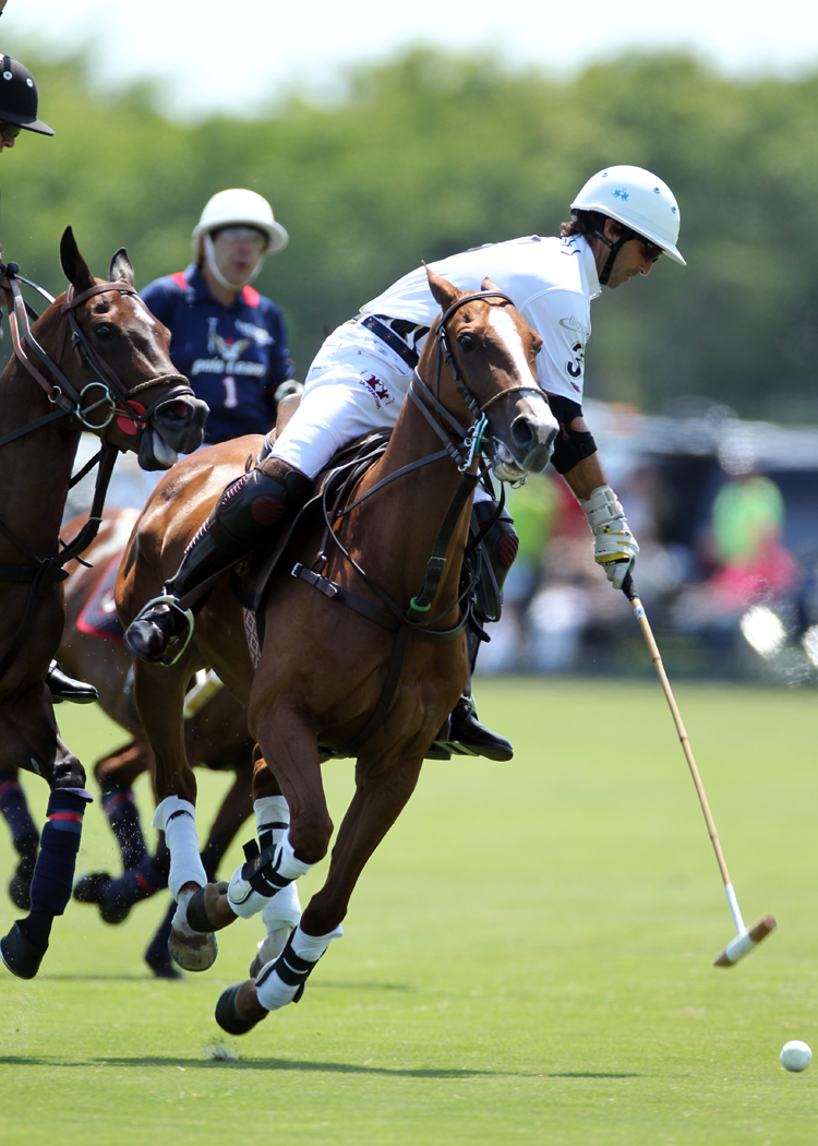 Piaget 10-goaler Miguel Astrada controls the ball despite defensive pressure